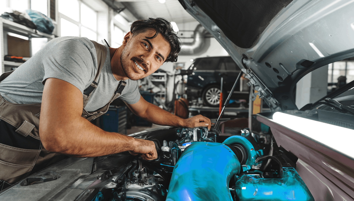 9 young male mechanic examining engine under hood of 2023 05 17 17 11 32 utc copy