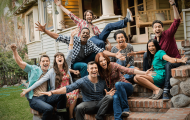 a group of friends sitting on the steps of a house 2022 03 04 02 20 06 utc