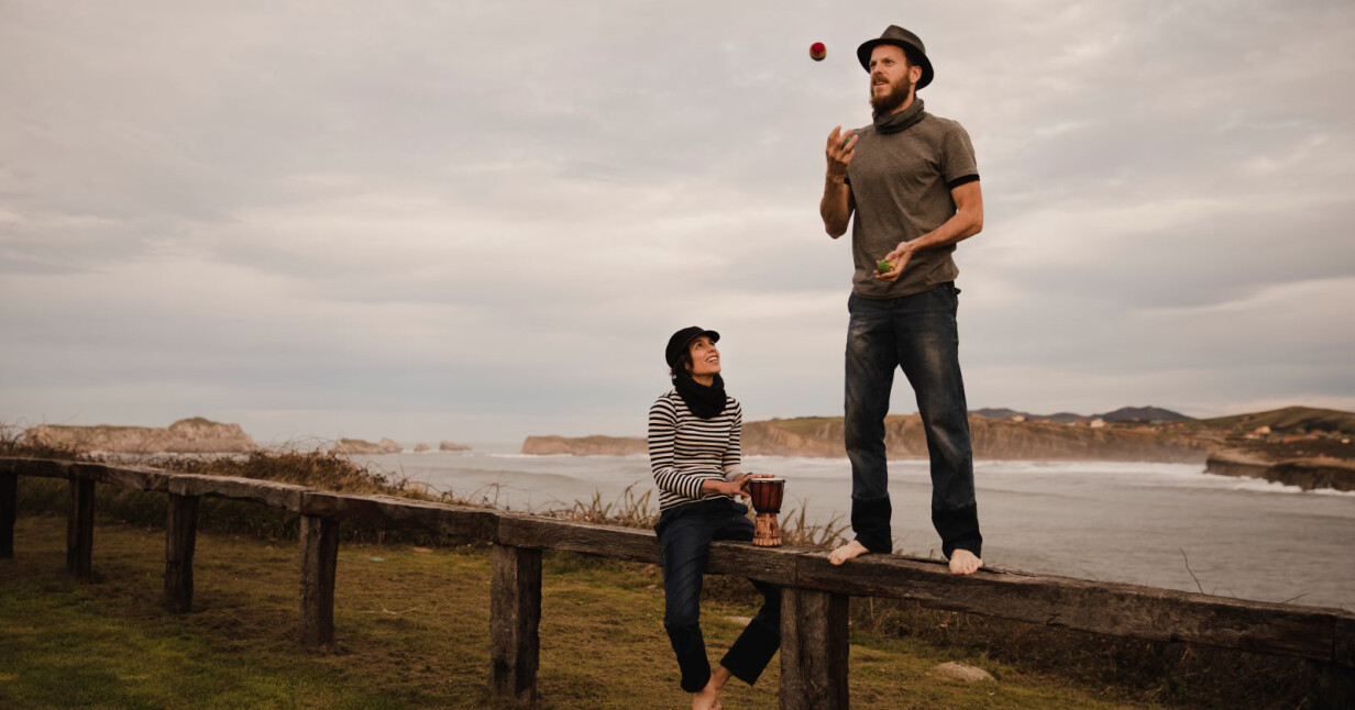 man juggling balls on bench near woman with drum o 2022 03 04 05 49 05 utc 2 v2