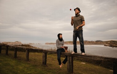 man juggling balls on bench near woman with drum o 2022 03 04 05 49 05 utc