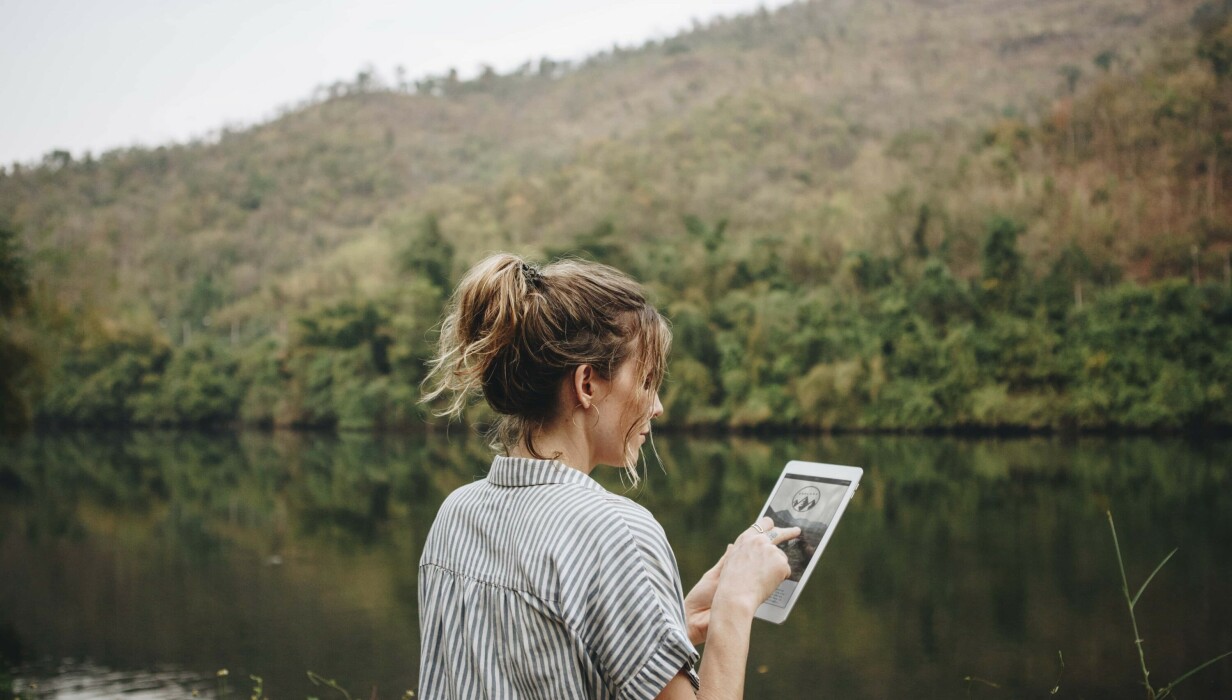 tinywow woman alone in nature using a digital tablet inter 2022 12 15 22 55 26 utc 33697699