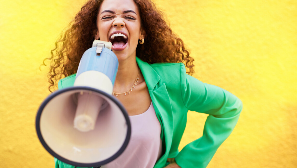 woman megaphone and protest on yellow background 2023 03 01 21 00 45 utc v2