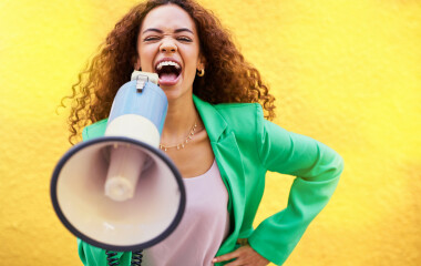 woman megaphone and protest on yellow background 2023 03 01 21 00 45 utc v2